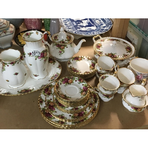 1013 - A Collection of Royal Albert old English country rose dinner and tea ware including tea pot tureen a... 