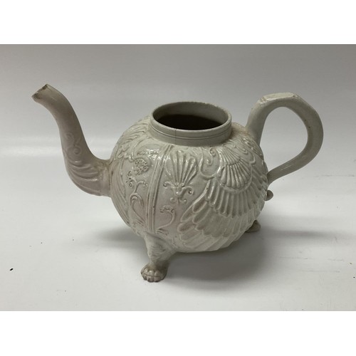 1017 - A white salt glazed teapot, pecten shell pattern.