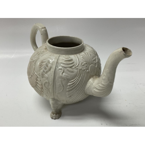 1017 - A white salt glazed teapot, pecten shell pattern.