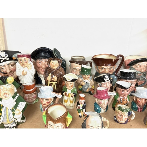 1031 - A collection of Doulton & Toby character jugs