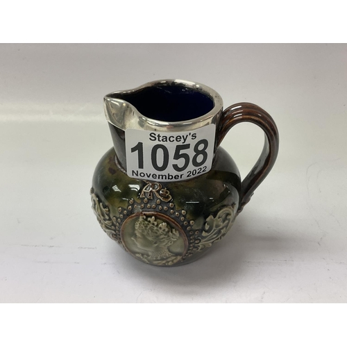 1059 - A small Doulton Stoneware commemorative jug with hallmarked silver rim