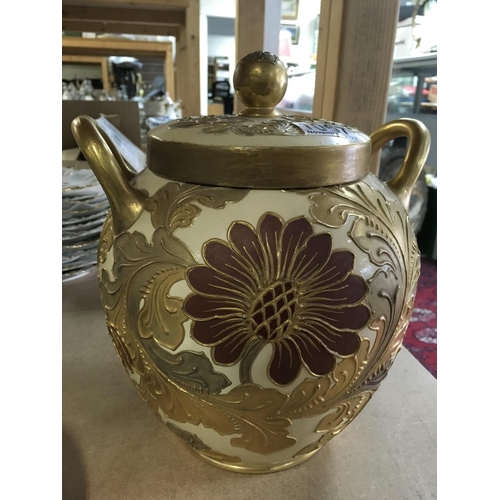 1067 - A Wedgwood George Marsden twin handled jar and cover decorated with raised flowers and foliage. Heig... 