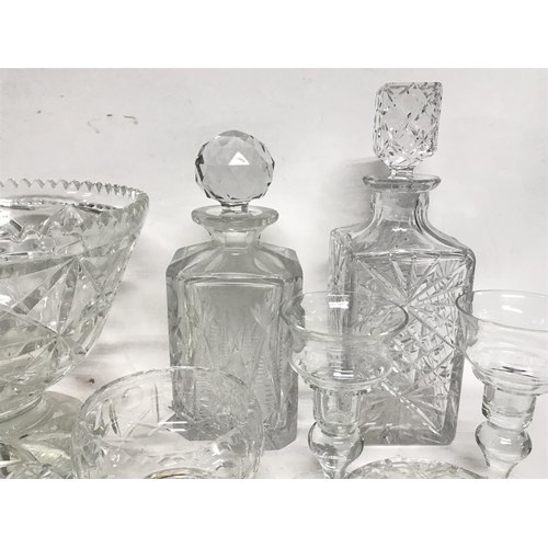 1080 - Collection of cut glass including bowls, decanters