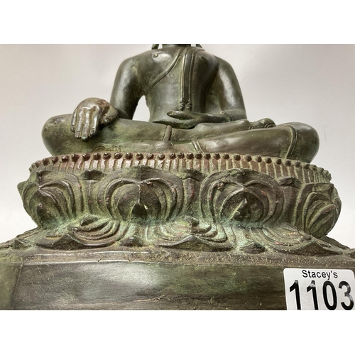 1103 - A large cast bronze figure of a Thai Buddha. 44cm.