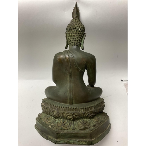 1103 - A large cast bronze figure of a Thai Buddha. 44cm.