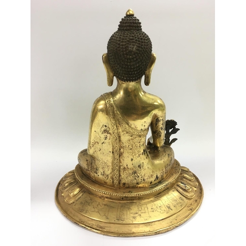 1113 - A gilt bronze buddha, approx height 28cm.