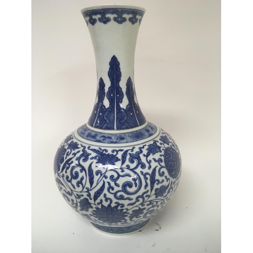 1118 - A Chinese republic period blue and white export porcelain bulbous bottle vase decorated with flowers... 