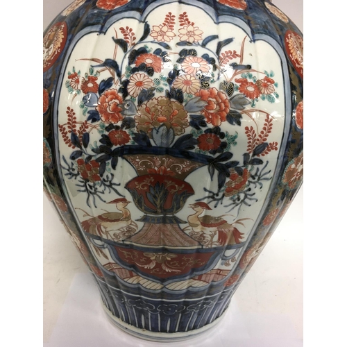 1124 - A large and impressive Imari vase and cover with detachable lid decanted with panels of birds flower... 