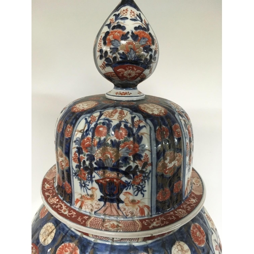 1124 - A large and impressive Imari vase and cover with detachable lid decanted with panels of birds flower... 