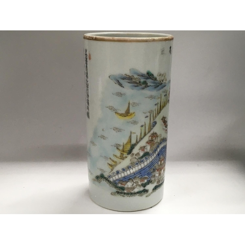 1139 - A Chinese Republic cylindrical vase decorated with landscape view. 13cm in height. Restoration to ri... 