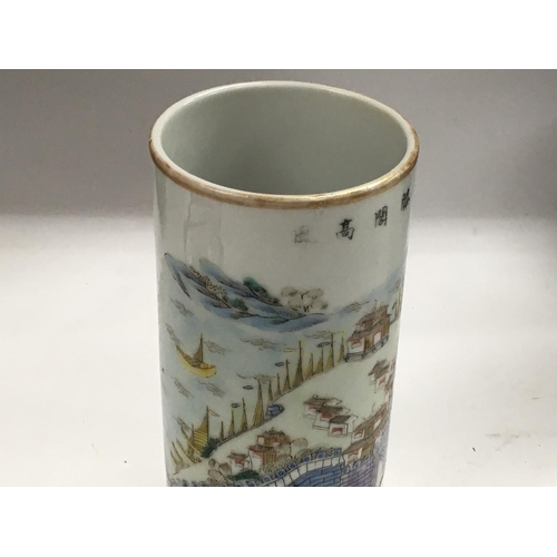 1139 - A Chinese Republic cylindrical vase decorated with landscape view. 13cm in height. Restoration to ri... 