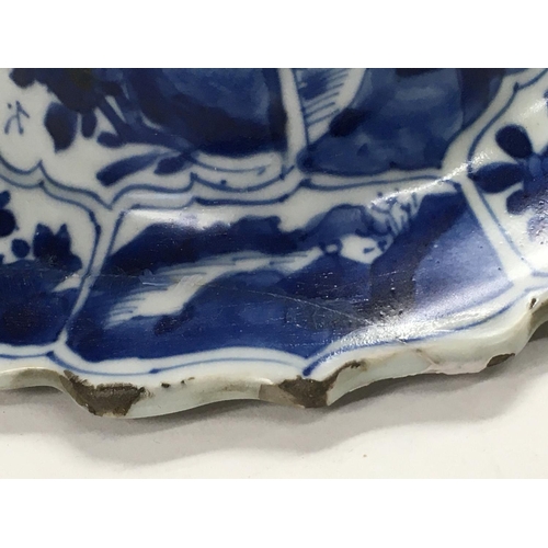 1140 - A Kangxi blue and white lid decorated with landscape views. 16cm across