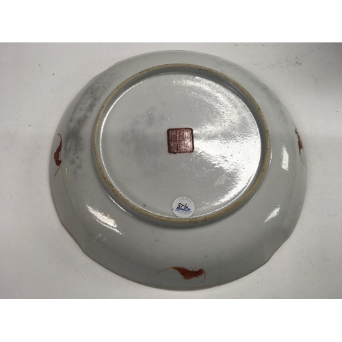 1141 - A Chinese Republic saucer decorated with pagodas. Chips and cracks