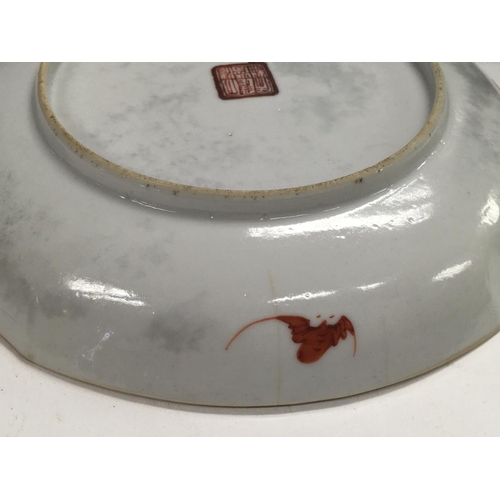 1141 - A Chinese Republic saucer decorated with pagodas. Chips and cracks