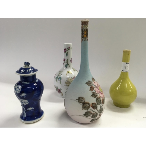 1148 - A collection of four oriental bottle vases with various decoration