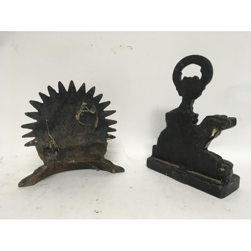 1204 - 2 x Victorian iron door stops