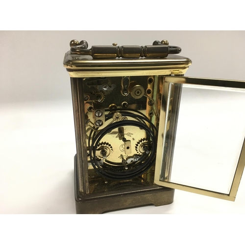 1207 - A French brass cased carriage clock, comes with key.