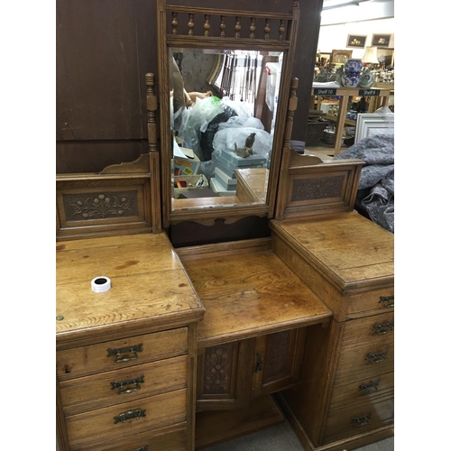 1261 - A quality late Victorian carved oak compactum wardrobe with matching dressing table. With quality ca... 