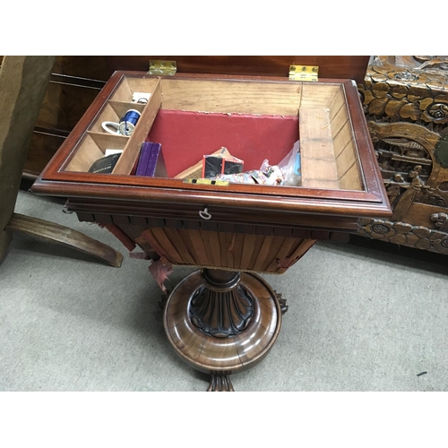 1269 - A Victorian Mahogany work box with a hinged top on a a turned column with stylised acanthus leaves a... 