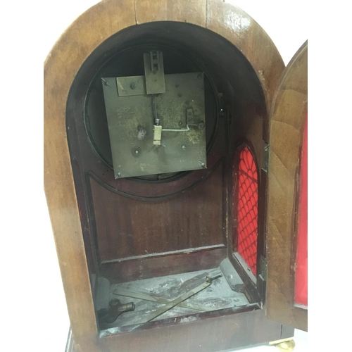 1283 - A mahogany mantle clock with an enamel dial and brass mounted case no pendulum.