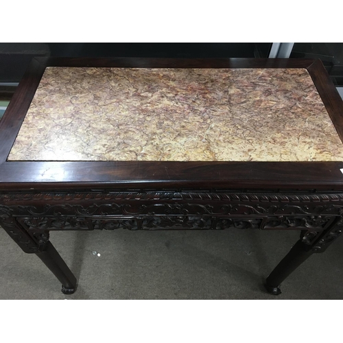 1292 - A Chinese side table inset with Rose Marble, with carved and scrolled folate decoration. 87cm x 46cm... 