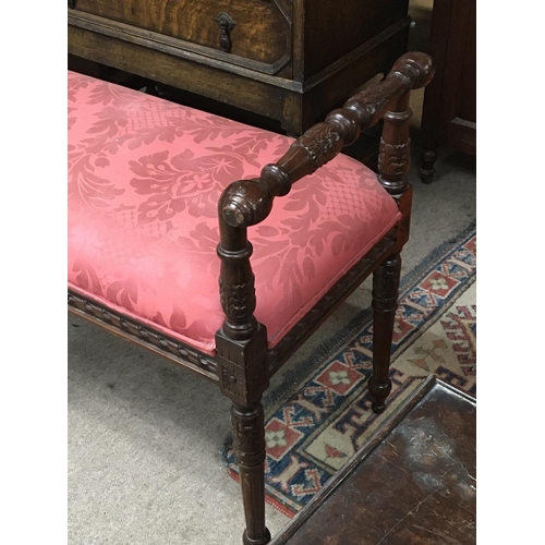 1327 - A late 19th century window seat with a red patterned upholstery tapering legs the side supports with... 