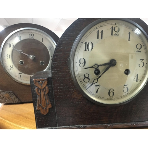 1970 - A collection of four oak mantle clocks with Arabic numerals.