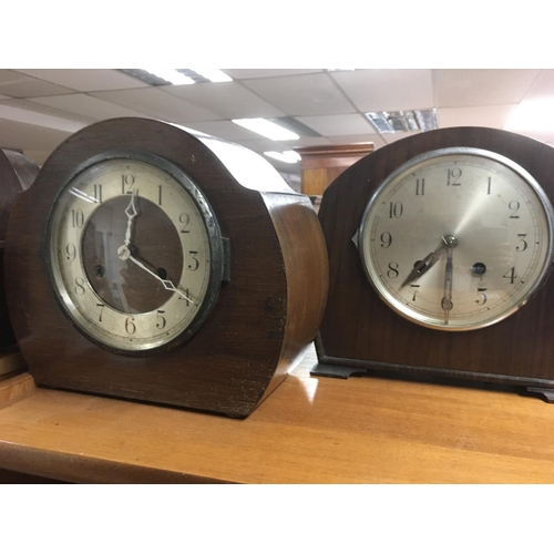 1970 - A collection of four oak mantle clocks with Arabic numerals.