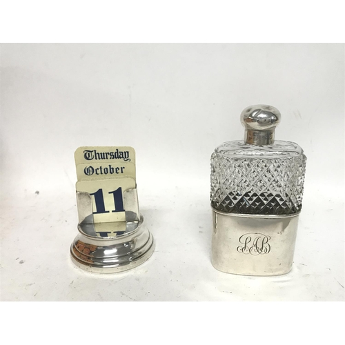 1982 - 2 x Silver items, a calendar and a glass hip flask