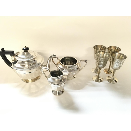 707 - Silver plated tea set and four goblets.