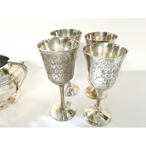 707 - Silver plated tea set and four goblets.