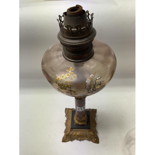 711 - A Victorian Brennan Oil lamp with polished stone central column. 43cm.