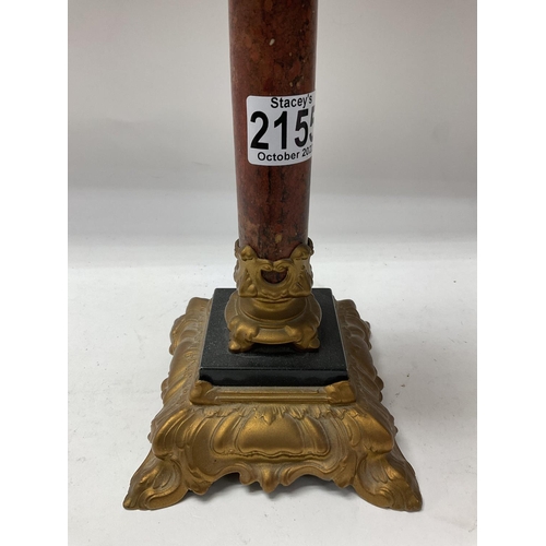 711 - A Victorian Brennan Oil lamp with polished stone central column. 43cm.