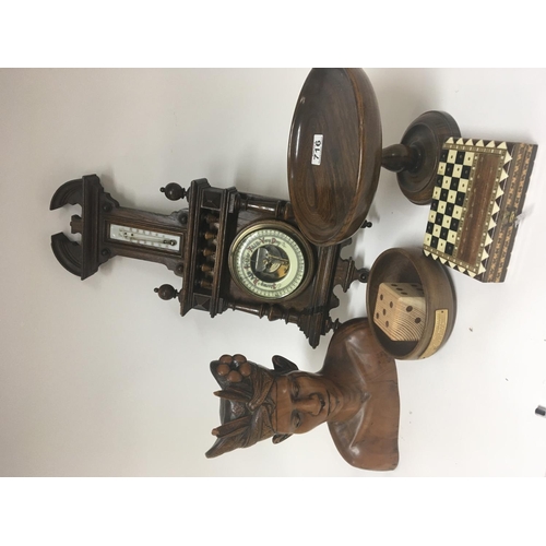 716 - A carved hard Wood Indonesian bust a barometer and other treen (a lot)