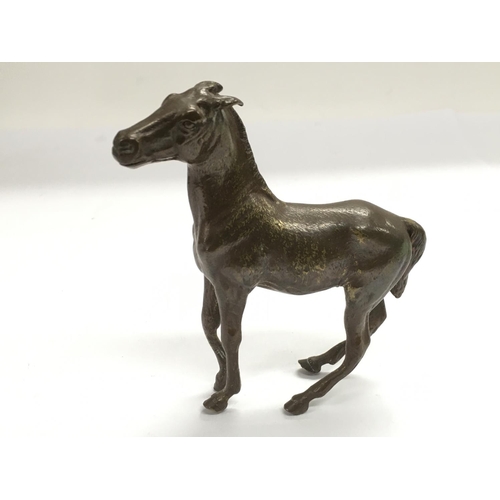 720 - A bronze figure of a horse, approx height 11cm.