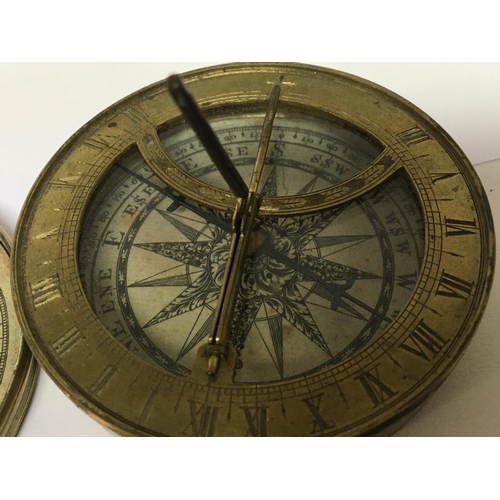 725 - A late 18th century or early 19th century small compass/ sundial with a paper printed dial and outer... 