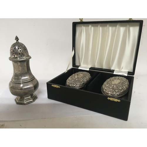 732 - A silver sugar caster London hallmarks and a pair of cased silver brushes.