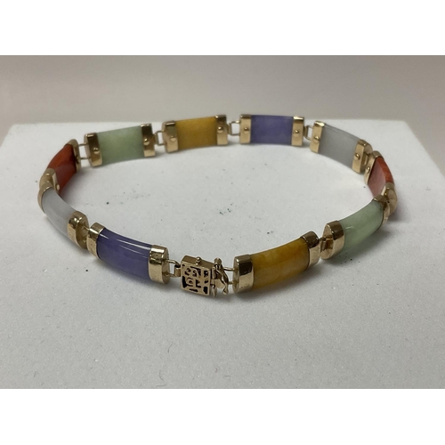 767 - A 9ct gold Chinese multicoloured stone bracelet.