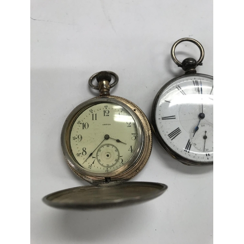 783 - A omega pocket watch with engraved case button wind together with a silver case
Pocket watch.