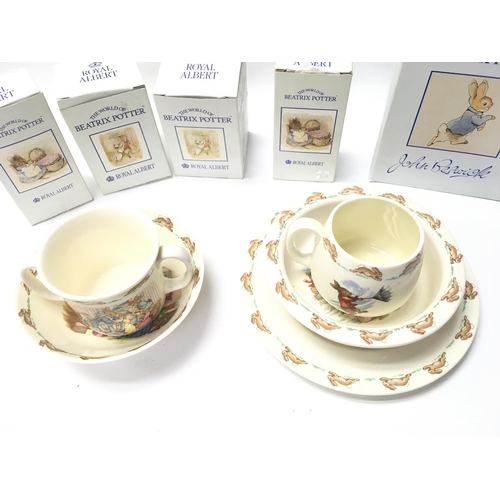 812 - A bunnykins Breakfast set and 4 Boxed Royal Albert Beatrix Potter Figures and a John Beswick.