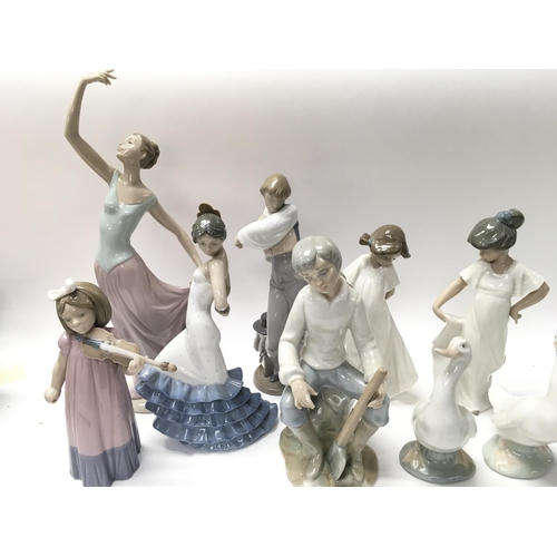 835 - A Collection of 9 Nao Figures.