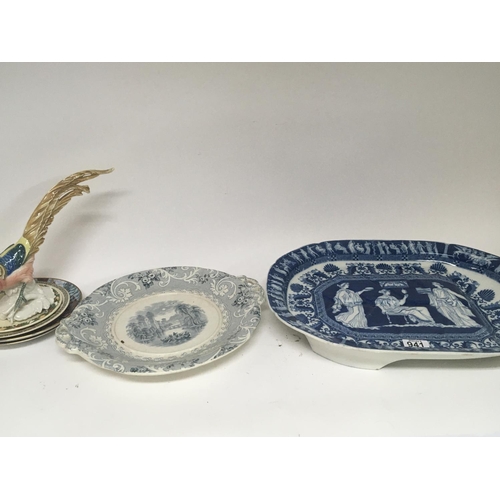 941 - A Victorian meat dish drainer with classical figures and other ceramics including a bird ornament. (... 