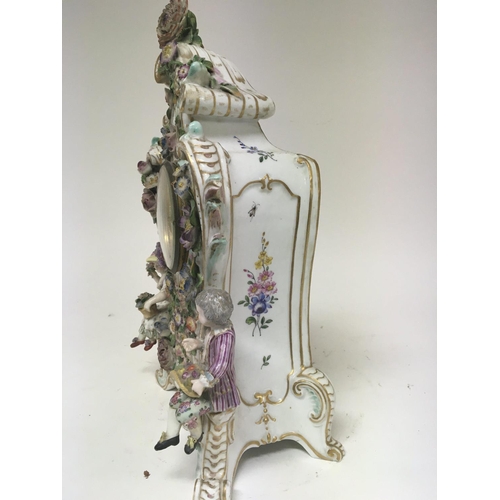 956 - A quality late 19th century German porcelain clock the case encrusted with raised flowers with two s... 