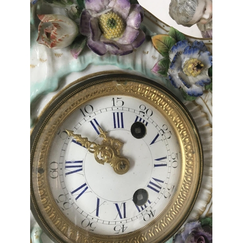 956 - A quality late 19th century German porcelain clock the case encrusted with raised flowers with two s... 