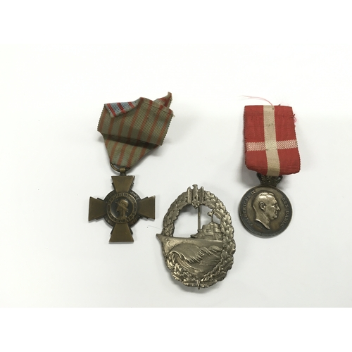 2119 - Three medals comprising a Danish example, one French and a Third Reich naval example.