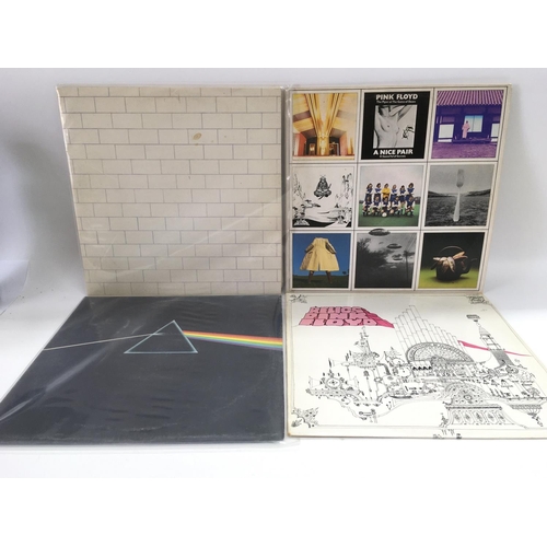 119 - Four Pink Floyd LPs comprising 'Dark Side Of The Moon', 'The Wall', 'Relics' and 'A Nice Pair'.