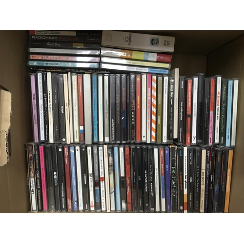 125 - A box of CDs by various artists including Miles Davis, Nirvana, Bjork and others.