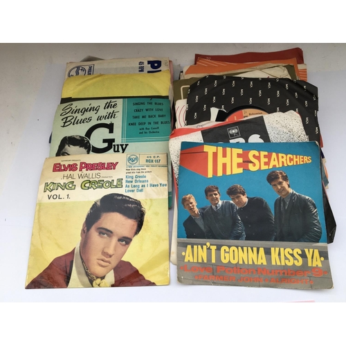 158 - A small collection of 7inch singles and EPs by various artists including The Beatles, Elvis Presley ... 