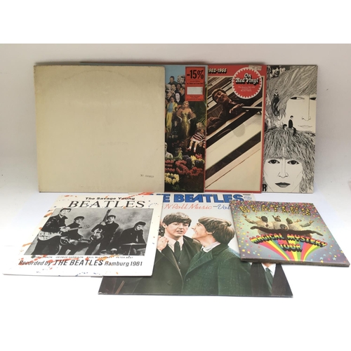 212 - A collection of Beatles LPs including a numbered 'White Album' No.0564619 (no inserts), 'Revolver' a... 