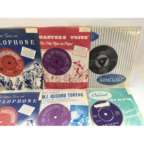 265 - A record case of rock n roll 7inch singles by various artists including Elvis Presley, Little Richar... 